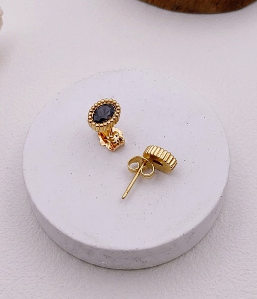 Elegant Oval Black Stone Stud Earrings with Beaded Gold-Tone Edge